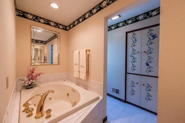 735 Cherrington Rd, Westerville, OH 43081 - bathroom with a tub with jets and tile patterned flooring