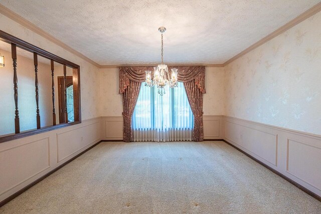 735 Cherrington Rd, Westerville, OH 43081 - carpeted spare room with a chandelier, a wainscoted wall, a textured ceiling, wallpapered walls, and ornamental molding