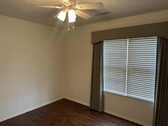 6667 Heatherstone Loop, Dublin, OH 43017 - spare room with dark wood-style flooring, ceiling fan, and baseboards
