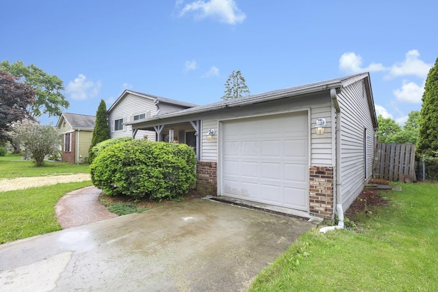 1703 Ringfield Dr, Galloway, OH 43119 - view of front of home with driveway, brick siding, and an attached garage