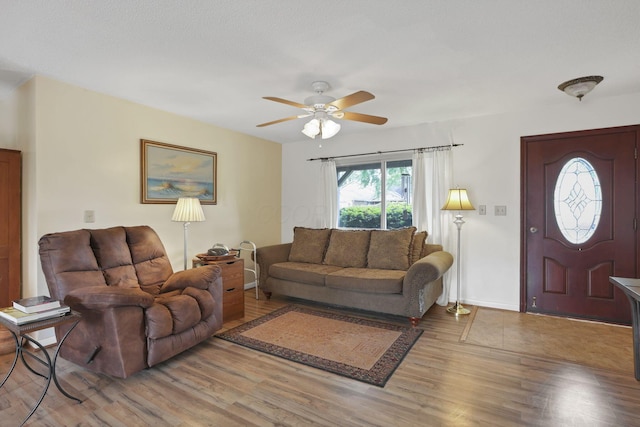 1703 Ringfield Dr, Galloway, OH 43119 - living area with light wood-style floors, ceiling fan, and baseboards