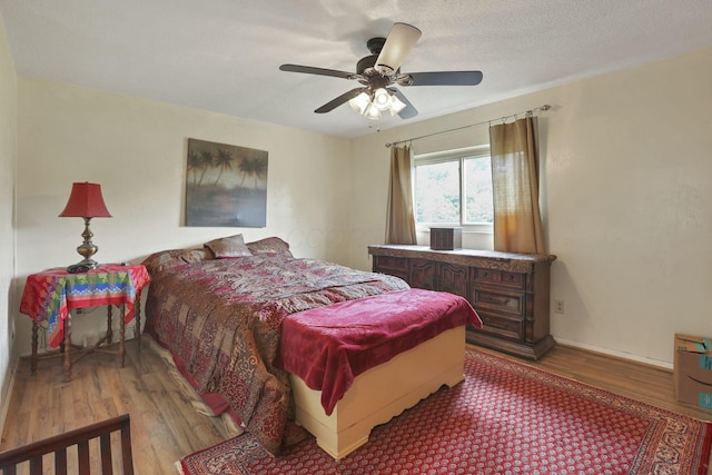 1703 Ringfield Dr, Galloway, OH 43119 - bedroom featuring wood finished floors, ceiling fan, and baseboards