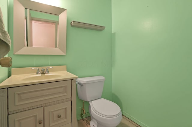 1703 Ringfield Dr, Galloway, OH 43119 - bathroom with toilet, vanity, and baseboards
