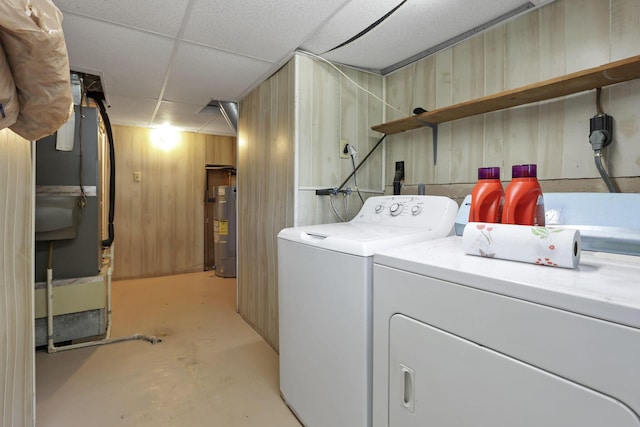 1703 Ringfield Dr, Galloway, OH 43119 - washroom featuring washer and dryer, water heater, and wooden walls