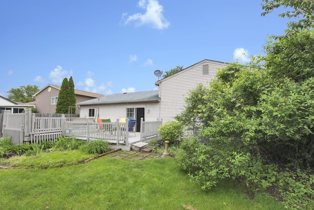1703 Ringfield Dr, Galloway, OH 43119 - rear view of property with a yard and a wooden deck
