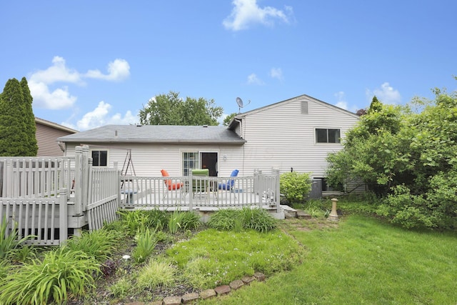 1703 Ringfield Dr, Galloway, OH 43119 - rear view of property featuring a deck and a lawn
