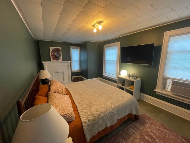 91 Oakland Park Ave, Columbus, OH 43214 - bedroom with cooling unit, carpet floors, crown molding, and baseboards