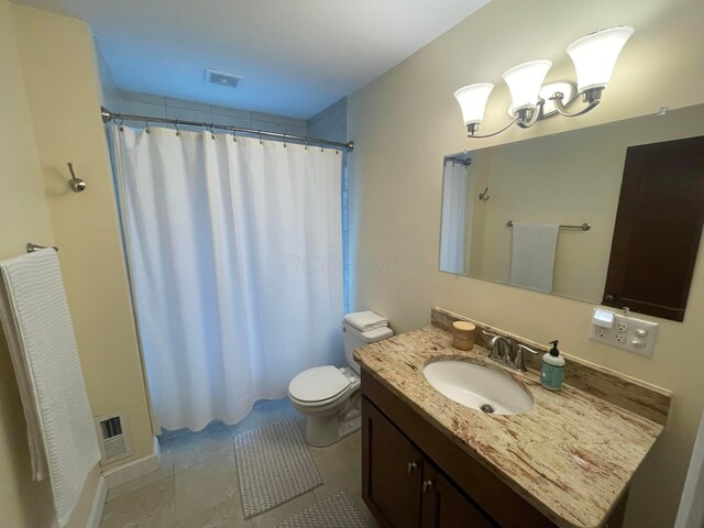 91 Oakland Park Ave, Columbus, OH 43214 - full bath with toilet, a shower with curtain, vanity, tile patterned flooring, and a chandelier