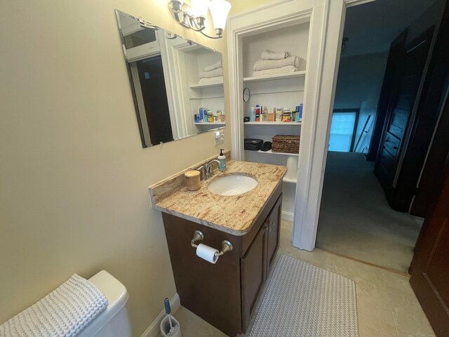 91 Oakland Park Ave, Columbus, OH 43214 - half bath featuring vanity and a chandelier