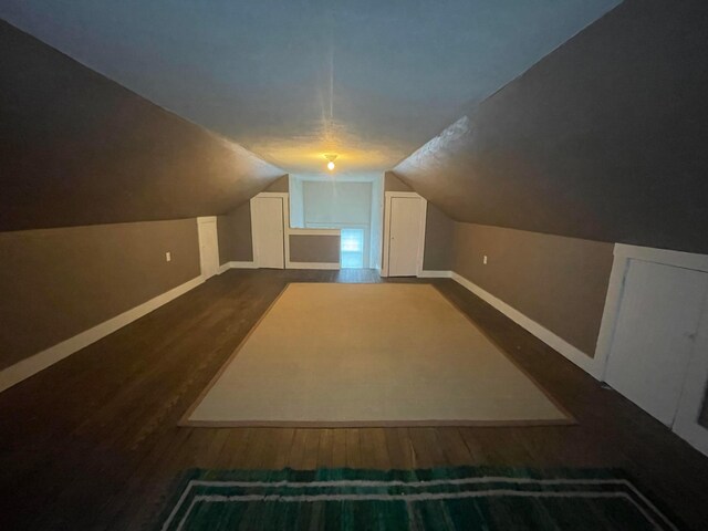 91 Oakland Park Ave, Columbus, OH 43214 - bonus room with baseboards, dark wood-style floors, and vaulted ceiling