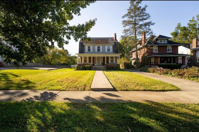 91 Oakland Park Ave, Columbus, OH 43214 - view of front of property with a porch and a front lawn