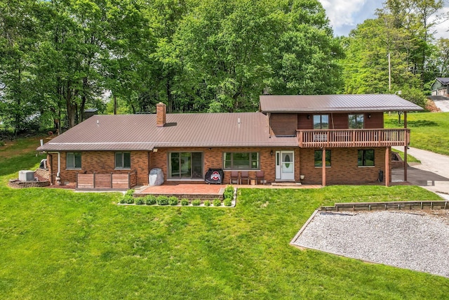 8485 Benson Rd NW, Carroll, OH 43112 - rear view of property featuring a patio, a chimney, metal roof, and a lawn