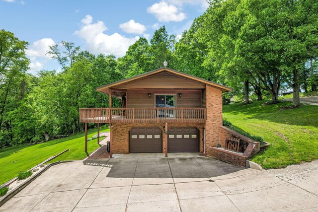 8485 Benson Rd NW, Carroll, OH 43112 - chalet / cabin with an attached garage, driveway, a front yard, and brick siding