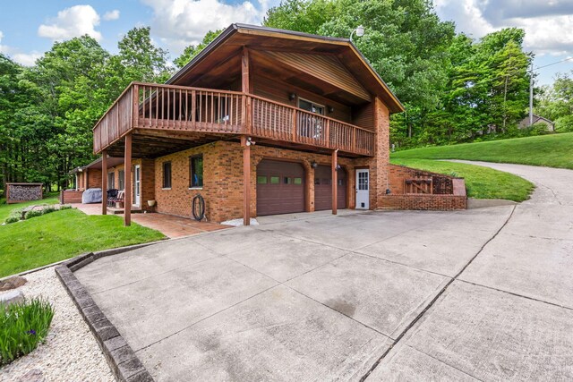 8485 Benson Rd NW, Carroll, OH 43112 - view of front of property with a front yard, a garage, brick siding, concrete driveway, and a deck