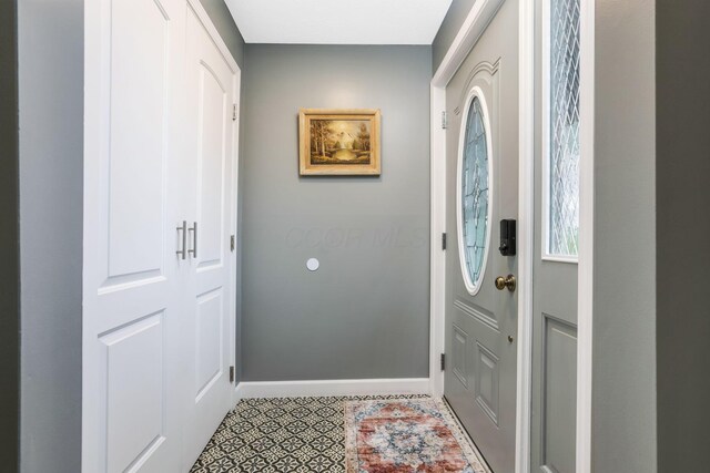 8485 Benson Rd NW, Carroll, OH 43112 - foyer entrance featuring baseboards and light tile patterned flooring