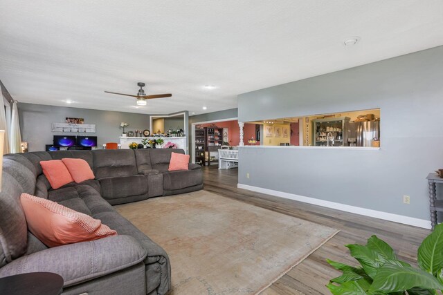 8485 Benson Rd NW, Carroll, OH 43112 - living room featuring wood finished floors, baseboards, a ceiling fan, and recessed lighting