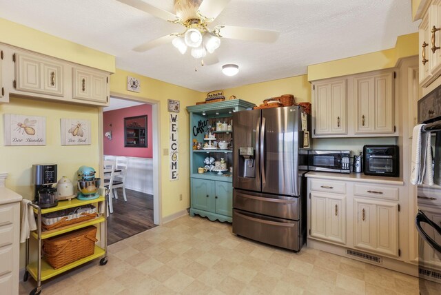 8485 Benson Rd NW, Carroll, OH 43112 - kitchen with appliances with stainless steel finishes, a ceiling fan, light floors, and light countertops