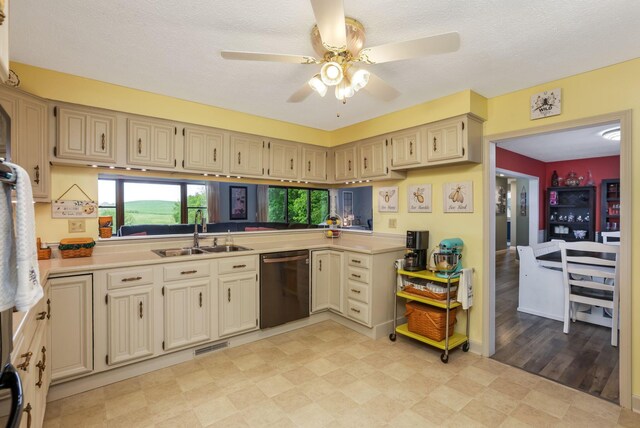 8485 Benson Rd NW, Carroll, OH 43112 - kitchen with dishwasher, a sink, and cream cabinets
