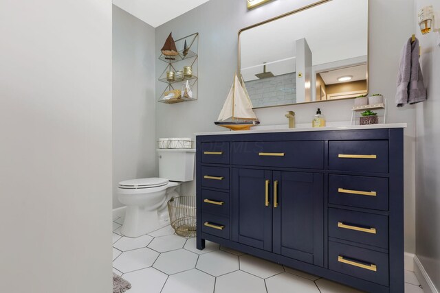 8485 Benson Rd NW, Carroll, OH 43112 - bathroom with toilet, vanity, baseboards, and tile patterned flooring