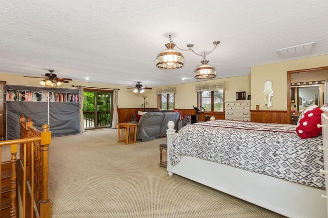8485 Benson Rd NW, Carroll, OH 43112 - bedroom featuring carpet flooring, a textured ceiling, a wainscoted wall, wooden walls, and access to outside