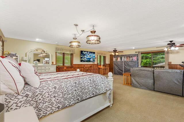 8485 Benson Rd NW, Carroll, OH 43112 - carpeted bedroom featuring wainscoting, access to outside, and a textured ceiling