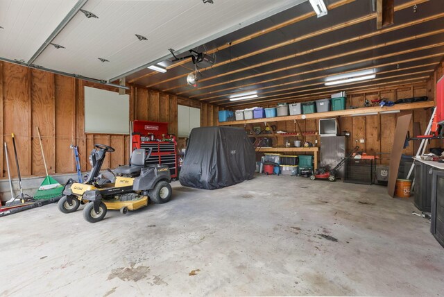 8485 Benson Rd NW, Carroll, OH 43112 - garage featuring a garage door opener and a workshop area