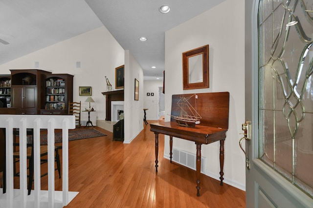 71 Donald Ross Dr, Granville, OH 43023 - entryway with wood finished floors, a fireplace, and recessed lighting