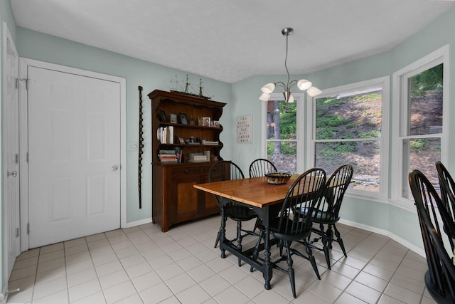 71 Donald Ross Dr, Granville, OH 43023 - dining space featuring plenty of natural light, light tile patterned floors, and a chandelier