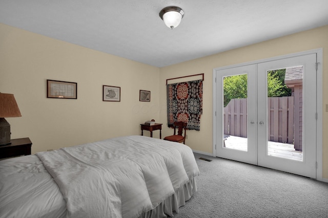 71 Donald Ross Dr, Granville, OH 43023 - carpeted bedroom featuring access to outside and french doors