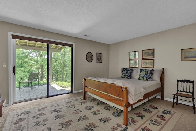71 Donald Ross Dr, Granville, OH 43023 - bedroom with access to exterior, light colored carpet, and a textured ceiling