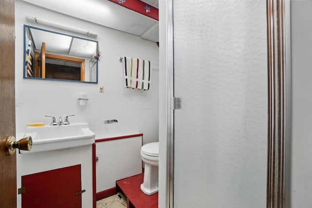 bathroom with toilet and vanity