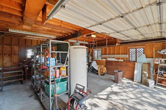 garage with a workshop area and a garage door opener