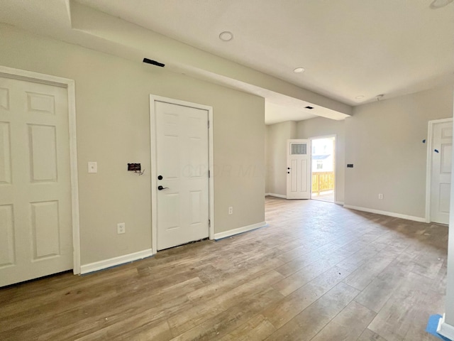 818 Bellows Ave, Columbus, OH 43223 - unfurnished living room featuring baseboards and wood finished floors
