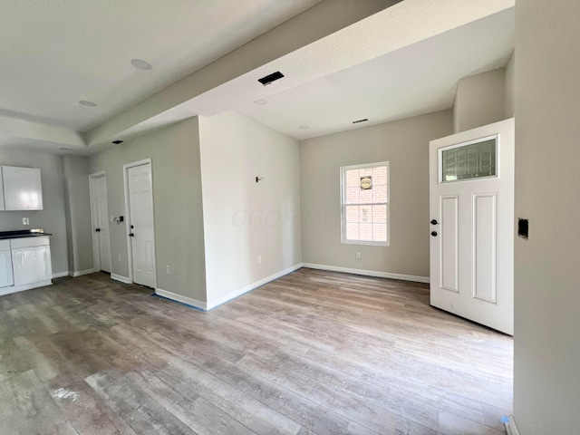 818 Bellows Ave, Columbus, OH 43223 - unfurnished living room with wood finished floors and baseboards