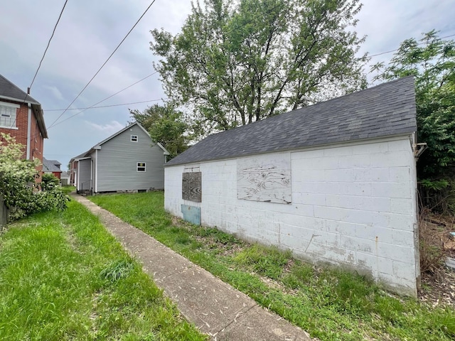 818 Bellows Ave, Columbus, OH 43223 - view of home's exterior with a shingled roof and an outbuilding
