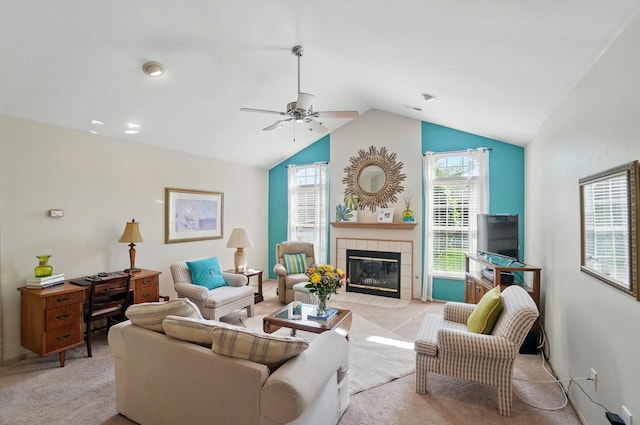 2675 Pine Marsh Dr, Grove City, OH 43123 - living area featuring light colored carpet, lofted ceiling, a ceiling fan, and a tiled fireplace