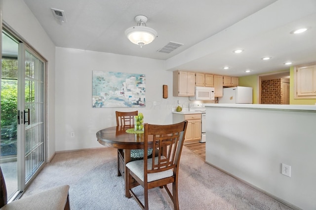 2675 Pine Marsh Dr, Grove City, OH 43123 - dining room featuring light colored carpet, baseboards, and recessed lighting