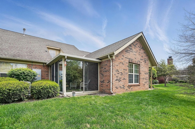 2675 Pine Marsh Dr, Grove City, OH 43123 - back of house featuring brick siding, a yard, a sunroom, and a shingled roof