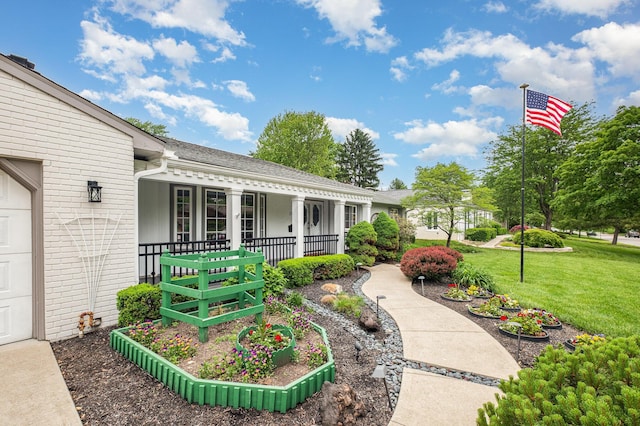 3145 Bembridge Rd, Columbus, OH 43221 - view of green lawn with a porch