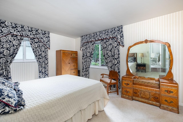3145 Bembridge Rd, Columbus, OH 43221 - bedroom with wallpapered walls, multiple windows, and carpet floors