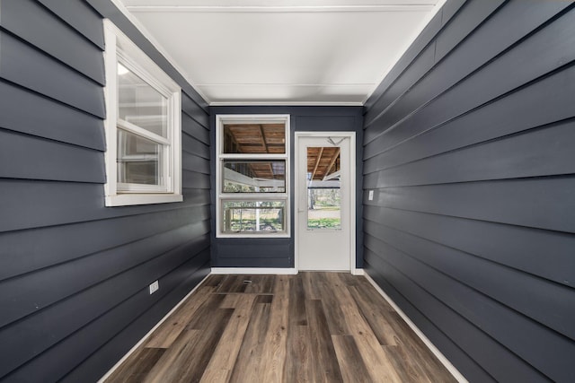 624 Bendle Ave, Shelby, OH 44875 - entryway featuring dark wood-type flooring and wooden walls