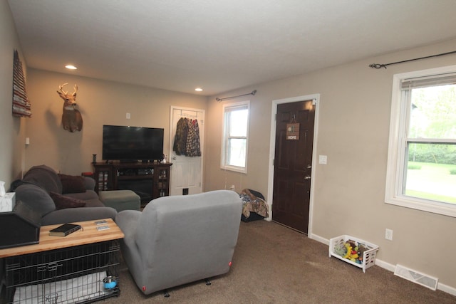 living room with carpet, baseboards, and recessed lighting