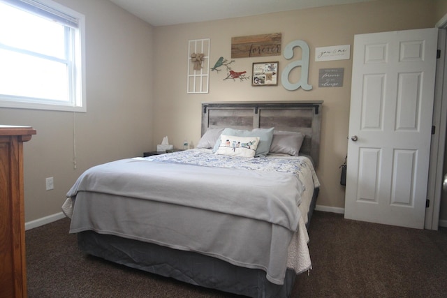 carpeted bedroom with baseboards