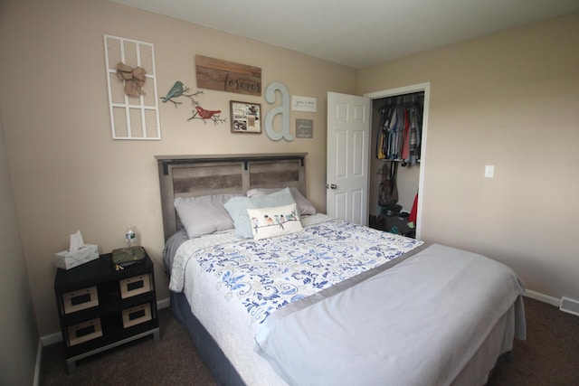 bedroom featuring dark colored carpet and baseboards