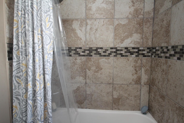 full bath featuring shower / bath combo with shower curtain