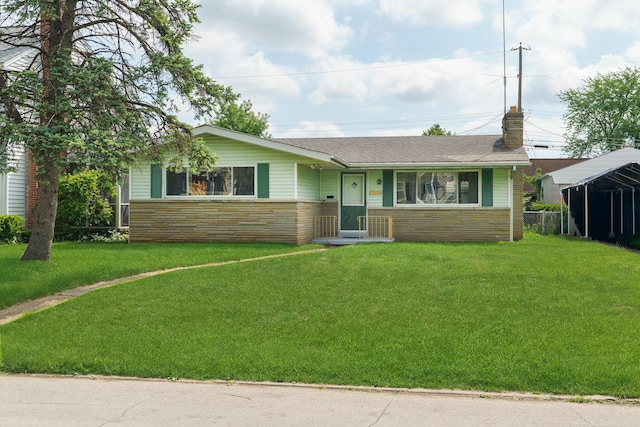 ranch-style house featuring a front yard, a chimney, and a shingled roof