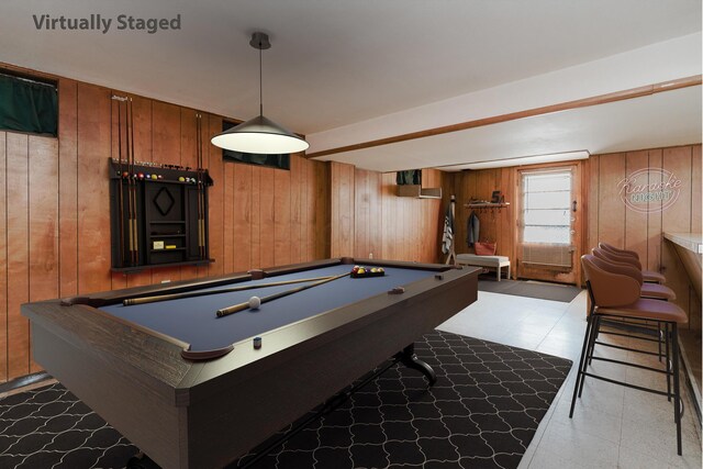game room with wooden walls, pool table, and light floors