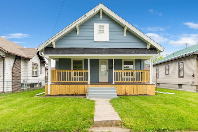 774 Congress St, Marion, OH 43302 - shotgun-style home featuring a shingled roof, covered porch, and a front yard