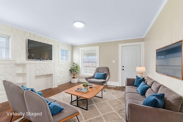 774 Congress St, Marion, OH 43302 - living room featuring crown molding, wood finished floors, healthy amount of natural light, baseboards, and a fireplace