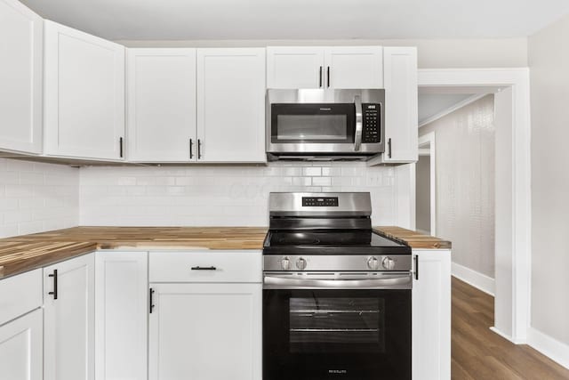 774 Congress St, Marion, OH 43302 - kitchen with wooden counters, appliances with stainless steel finishes, and baseboards